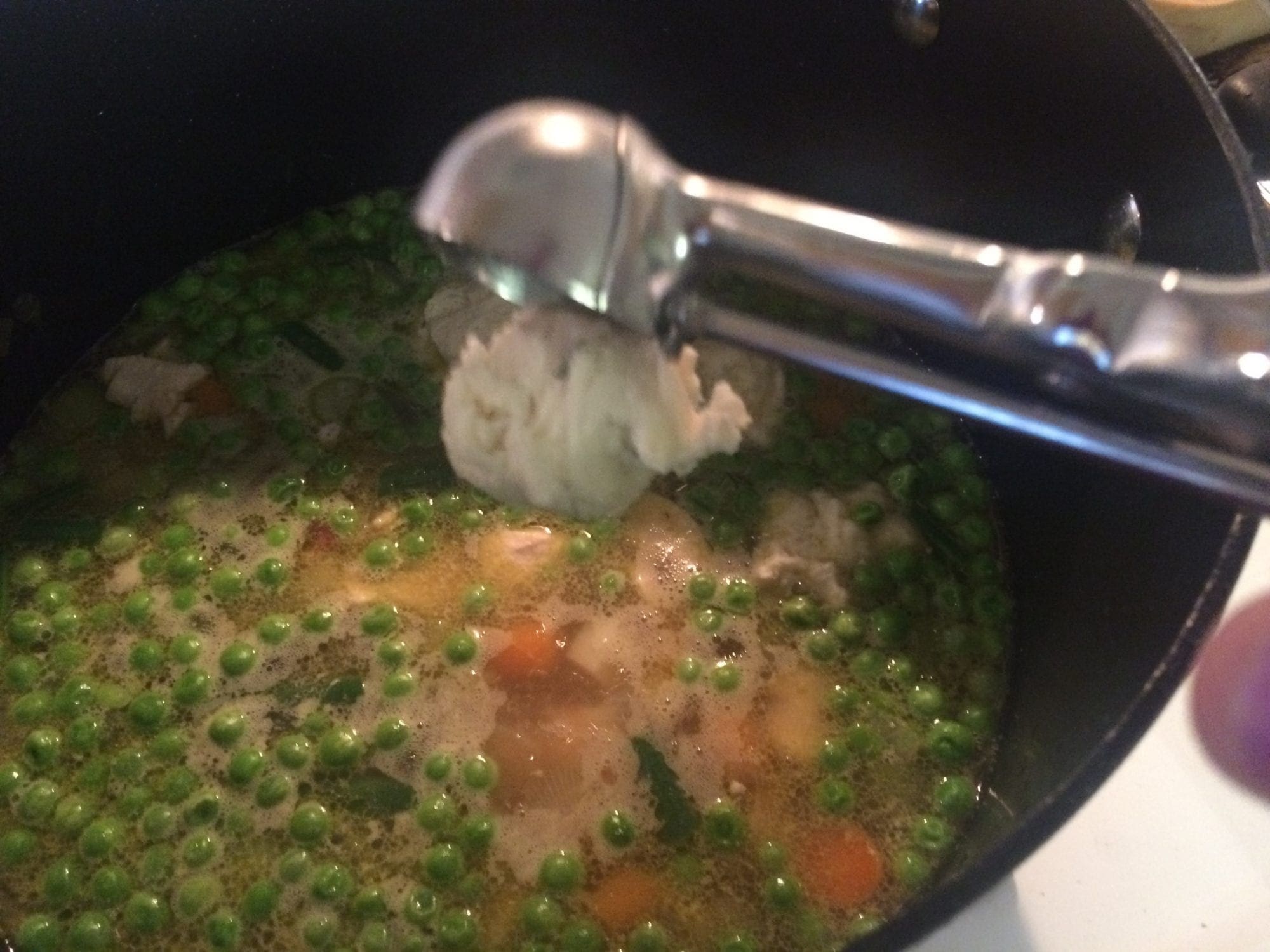 Drop dough balls in broth for chicken and dumplings.
