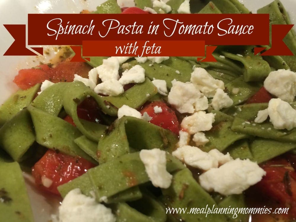 spinach pasta in tomato sauce with feta