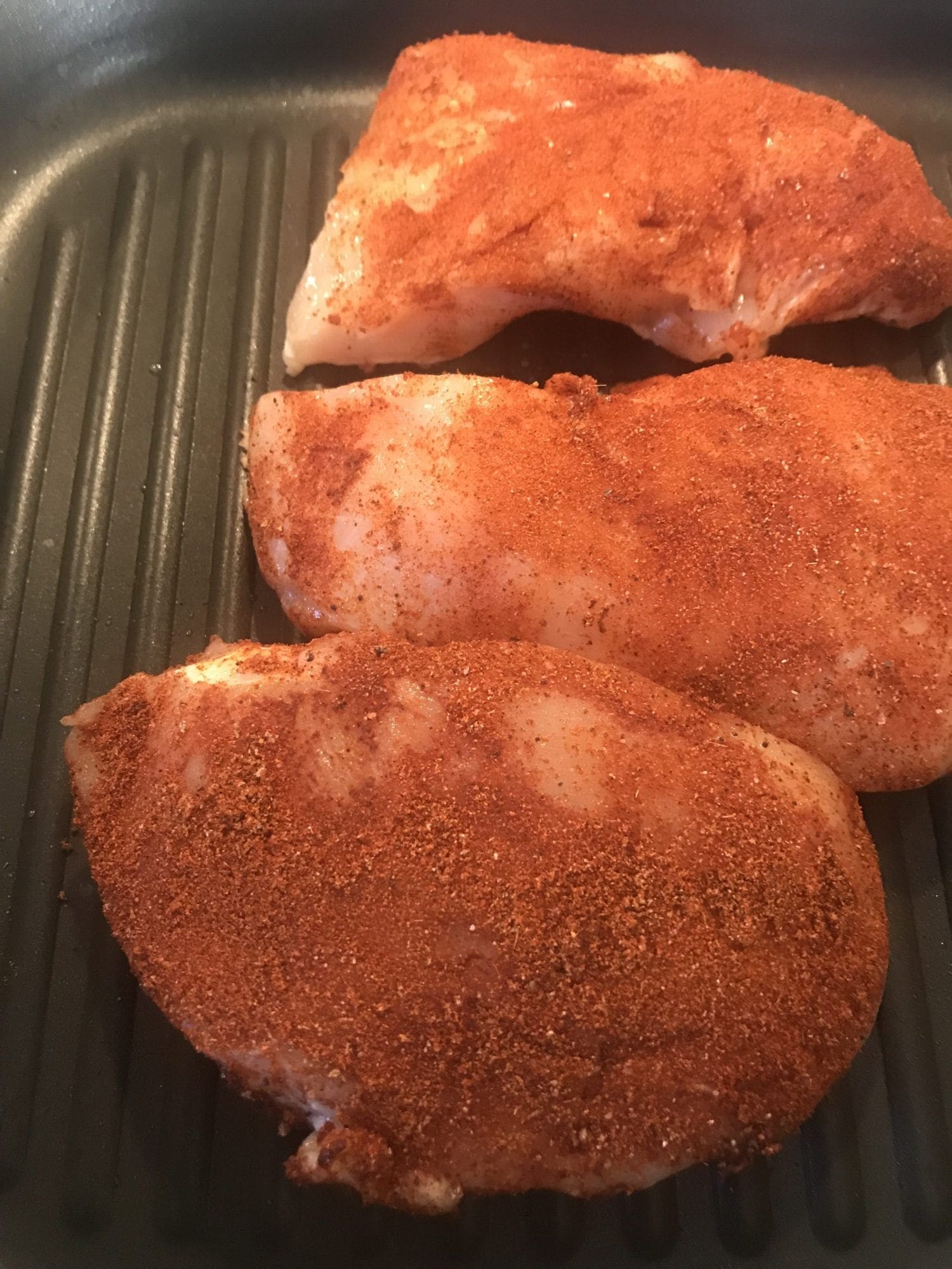 Rub seasoning on the chicken and grill the chicken