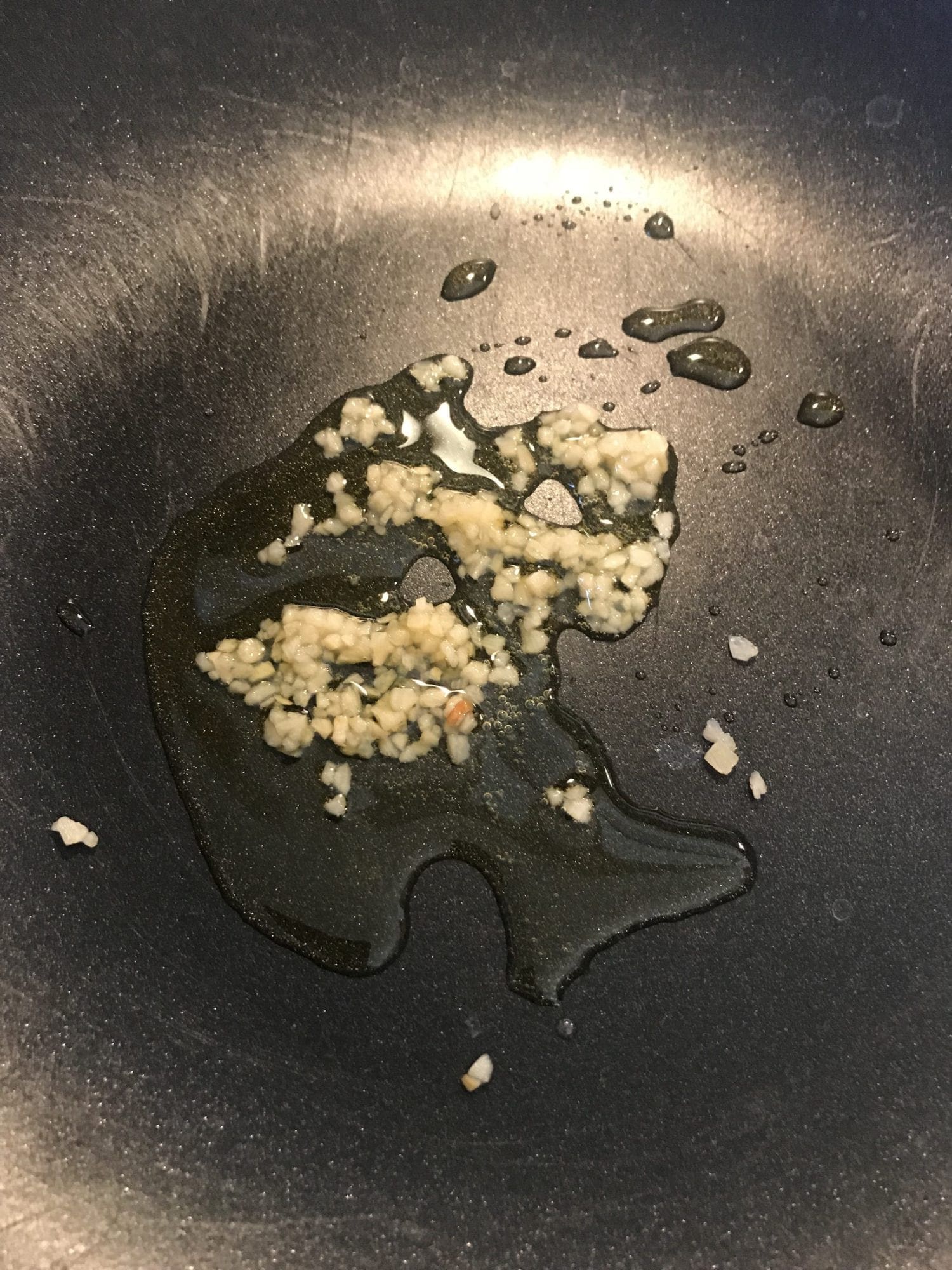 Cook garlic in oil