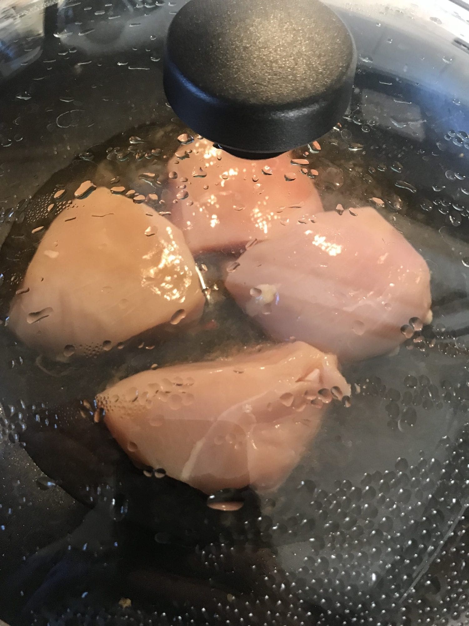cook chicken in the broth mixture