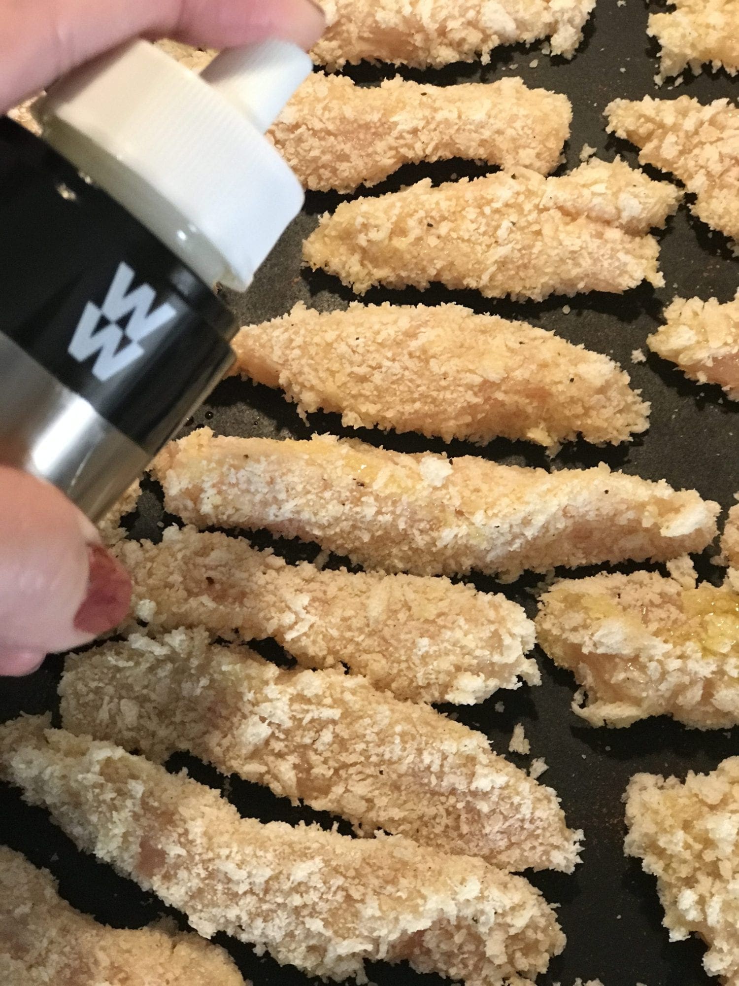 Spray chicken fries with cooking spray and baked until slightly browned.