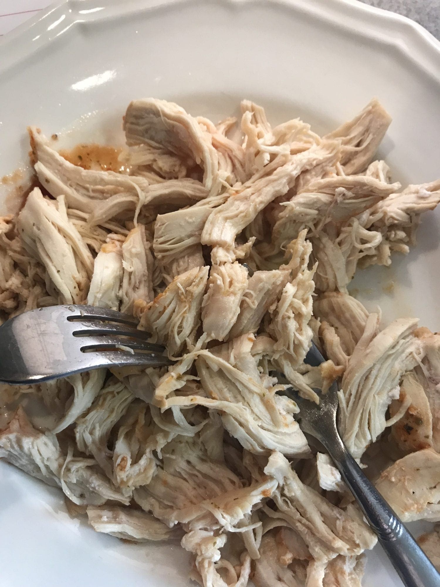 Shred chicken cooked in the Insant Pot or slow cooker with two forks.