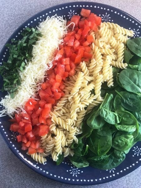 Delicious ingredients in a fresh and healthy Bruschetta Pasta Salad.