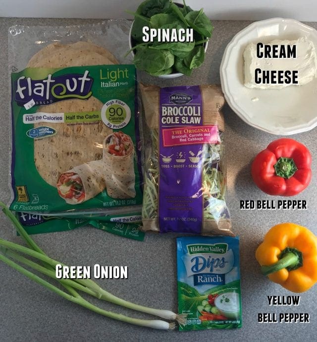 Ingredients in Alisha's Rainbow Ranch Pinwheels: Cream cheese, Ranch seasoning, broccoli cole slaw, spinach, bell peppers, green onion rolled in FlatOut wraps.