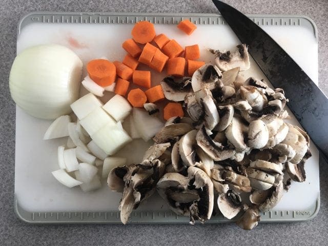 Perfect chopped vegetables for slow cooker beef burgundy: carrots, onion, and mushrooms