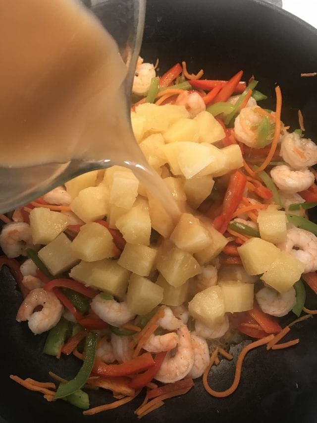 This sweet and sour shrimp stir fry is 4 Weight Watcher SmartPoints on the FreeStyle program. Cook the shrimp, pineapple, and bell peppers in a sweet and sour sauce served with brown rice on the side.