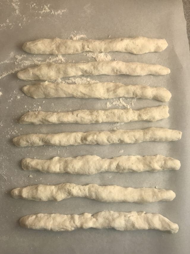Roll the dough into long snake-like pieces.