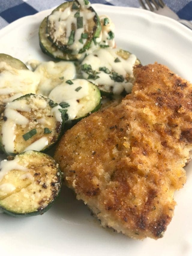 Seasoned chicken that is fried in a little butter and oil. Served with a side of sauteed zucchini topped with mozzrella cheese that is melted. Super yummy! Just 5 WW FreeStyle Smart Points per serving.