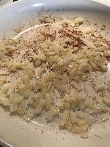 Cook onion and garlic in a saute pan.