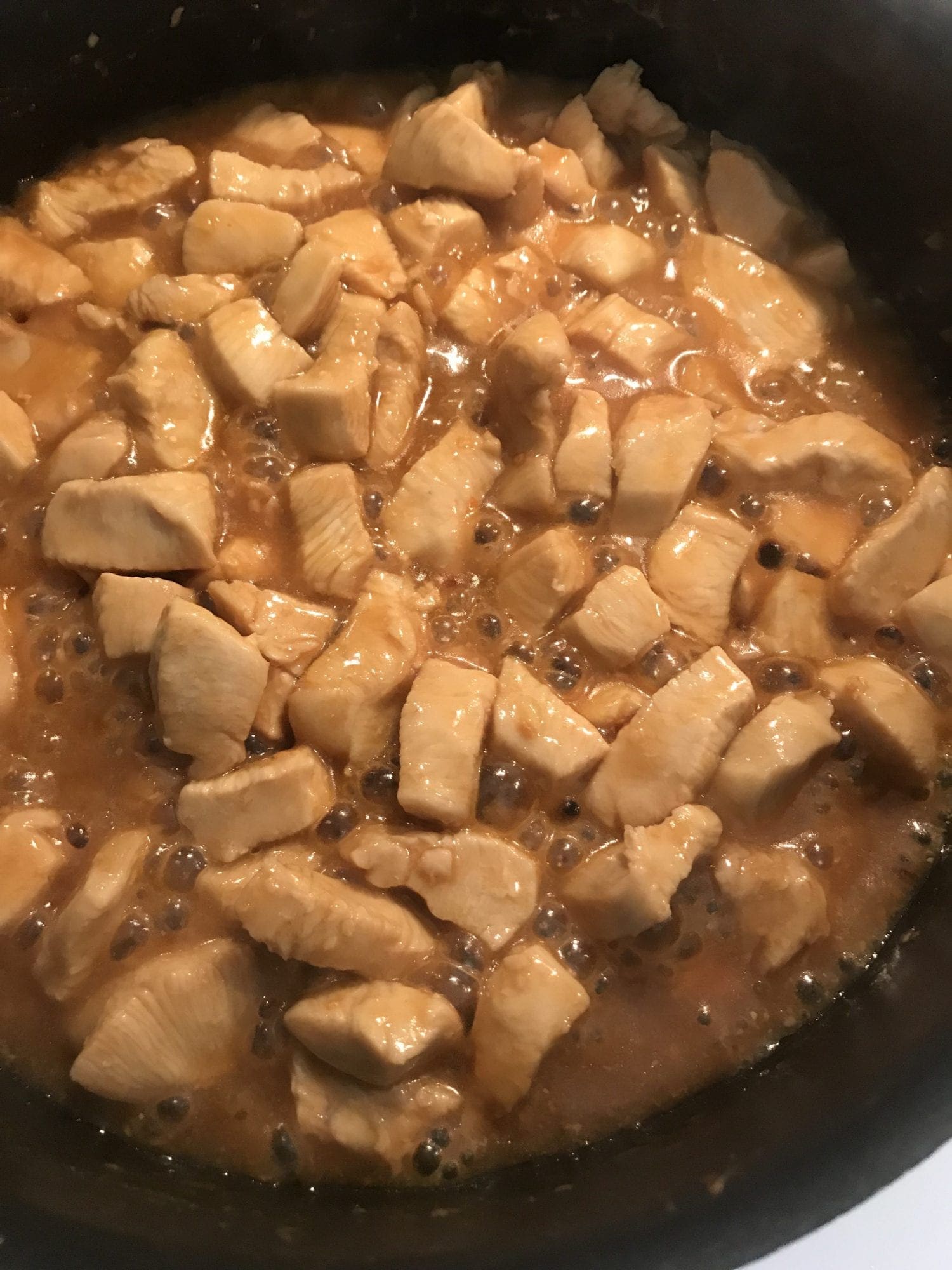 Chicken cooking in a sweet and soy sauce made of simple ingredients you probably already have.