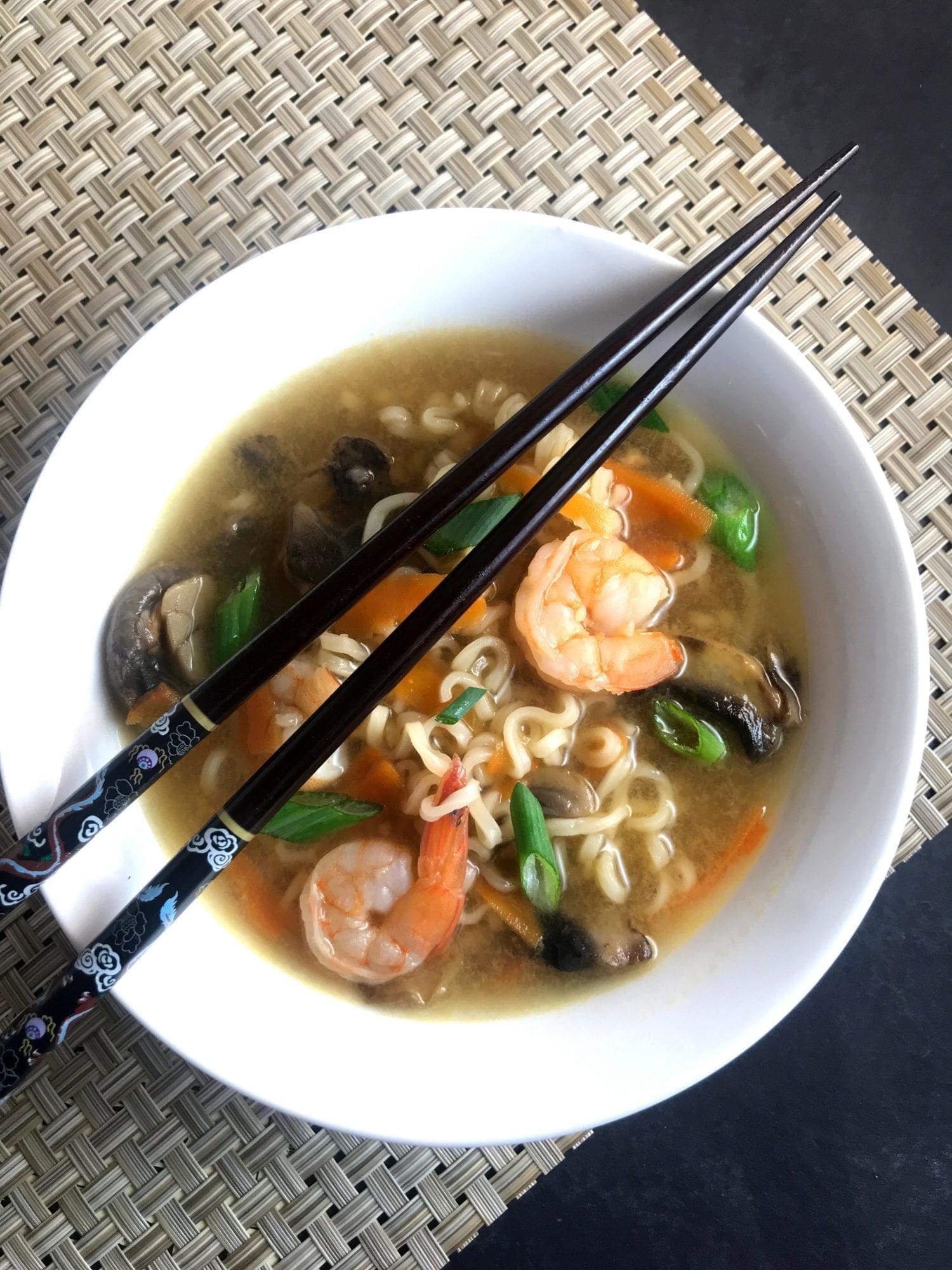 Shrimp, Ramen noodles, carrots, and mushrooms are cooked in a vegetable broth flavored with ginger and garlic in this simple Asian-style soup. Just 4 WW FreeStyle SmartPoints per serving.