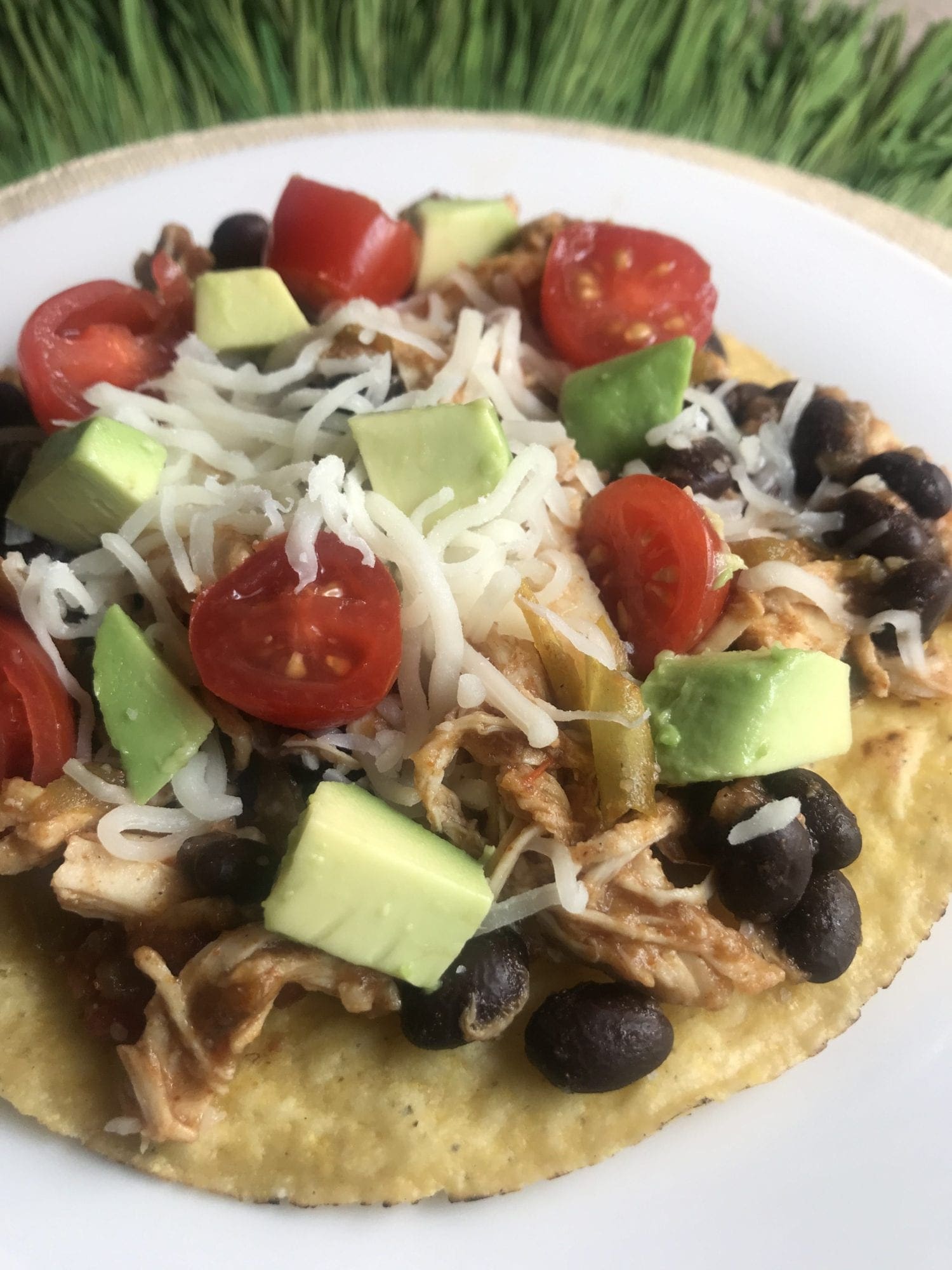 WW Chicken Tostadas on Meal Planning Mommies - Uses shredded chicken, black beans, avocado, tomatoes, and cheese - Just 4 WW FreeStyle SmartPoints per tostada!
