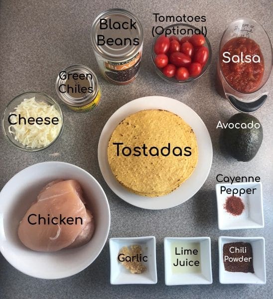 Simple ingredients for WW Chicken Tostadas on Meal Planning Mommies - Uses shredded chicken, black beans, avocado, tomatoes, and cheese - Just 4 WW FreeStyle SmartPoints per tostada!