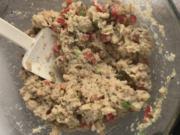 Mixture for salmon loaf: salmon, stuffing mix, broth, mayo, red bell pepper, green onion, etc.