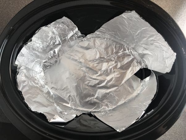 Line the slow cooker with two srips of aluminum foil so you can easily lift the meatloaf or salmon loaf out of the slow cooker.